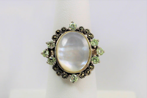 Mother of Pearl Ring with Peridot enhancement!  Only one Available in size 6!